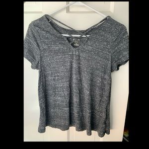 a shirt with cross in the front